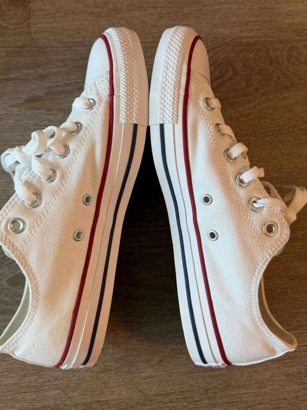 Converse Low Top Sneakers in White with Red Trim